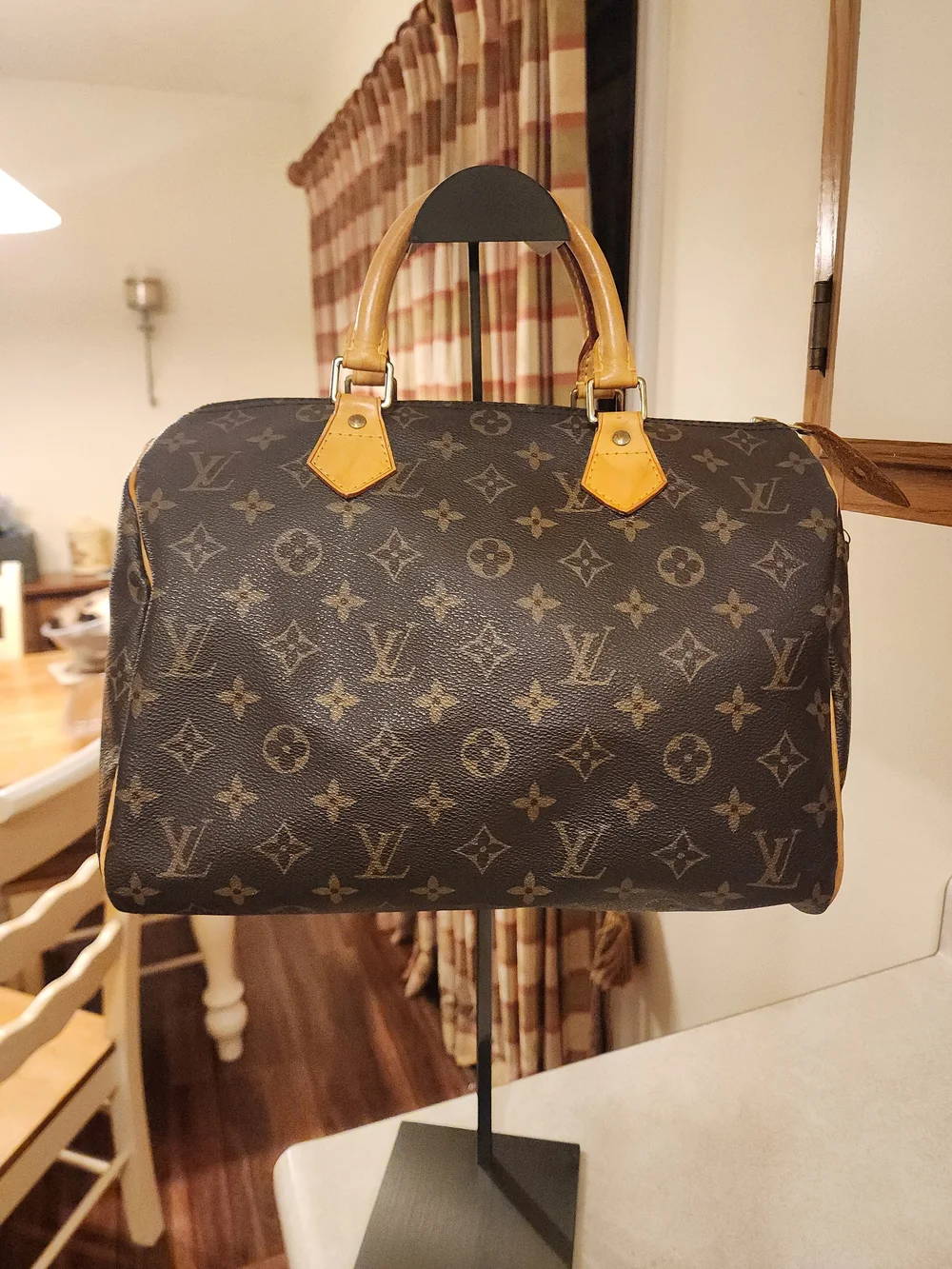 classic Louis Vuitton Monogram Speedy 30 featuring iconic brown coated monogram